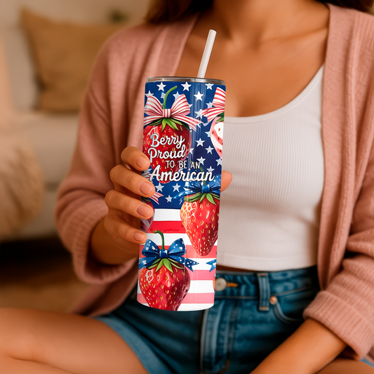 20oz tumbler with strawberry design and American flag print held by person wearing pink cardigan