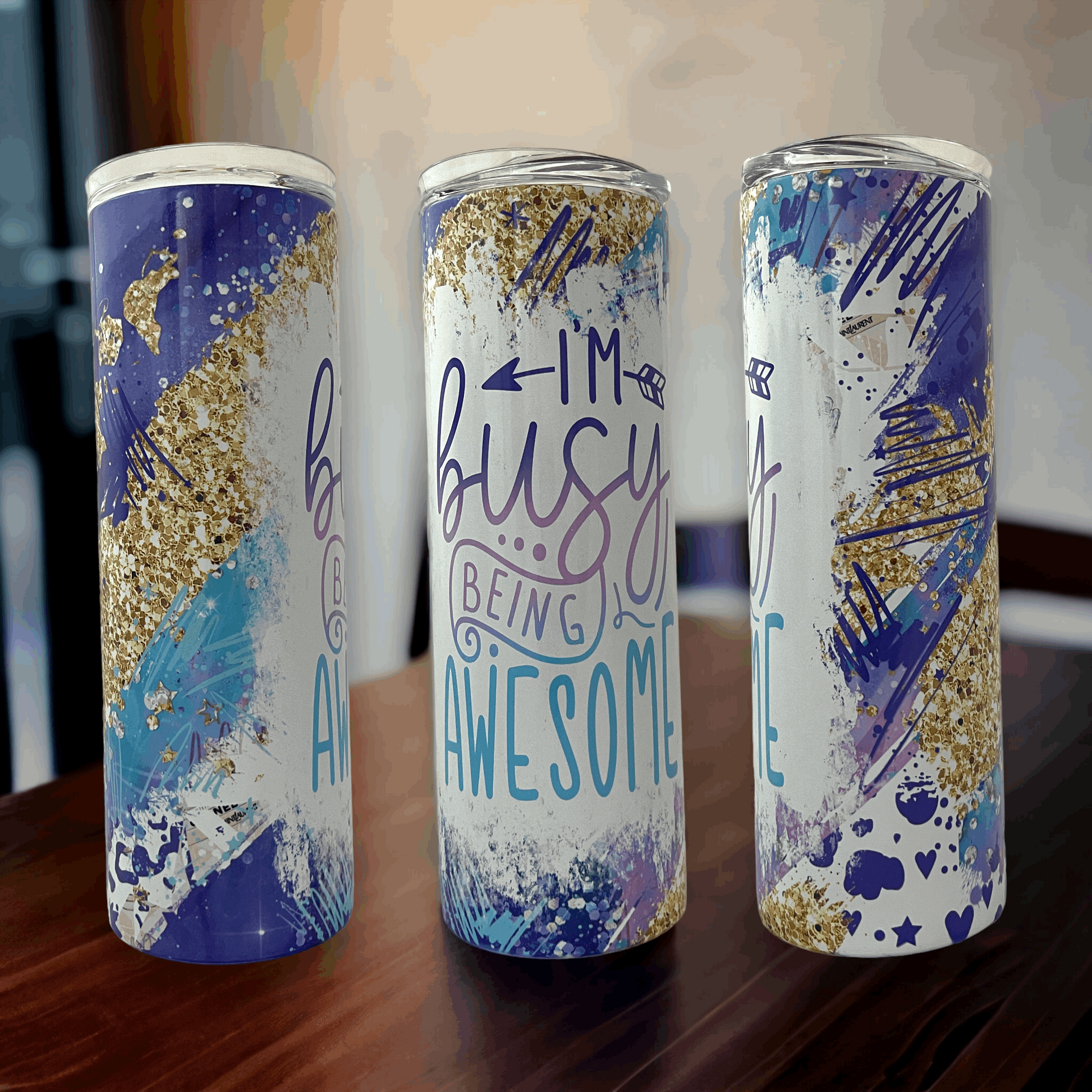20oz tumbler insulated with blue, purple, and gold abstract design and I’m busy being awesome text
