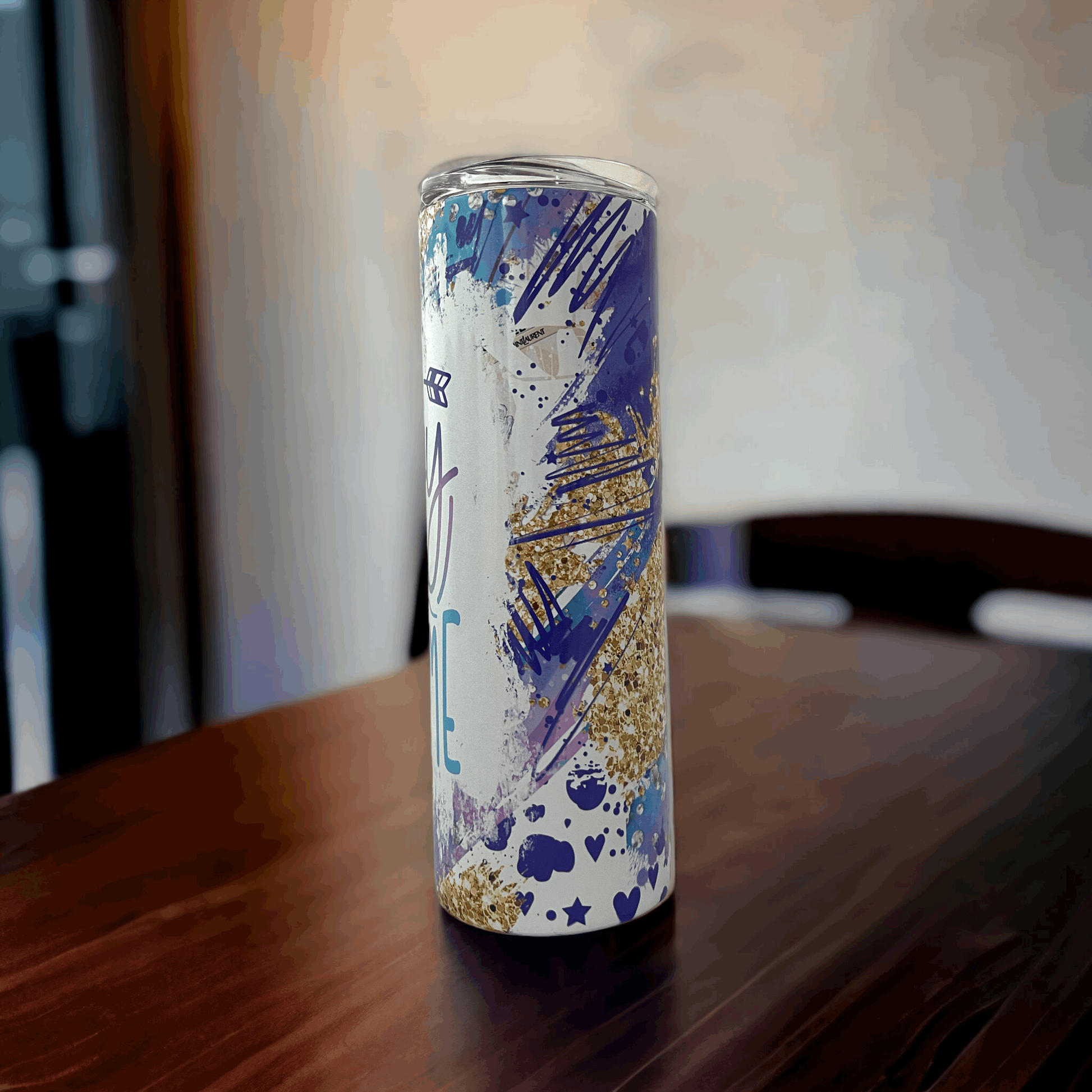 20oz tumbler insulated by Macies Handmade Treasure's with blue and gold glitter splatter design