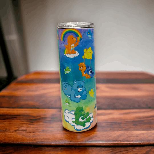 Macies Handmade Treasure's 20oz tumbler with colorful care bears care bear design on blue background