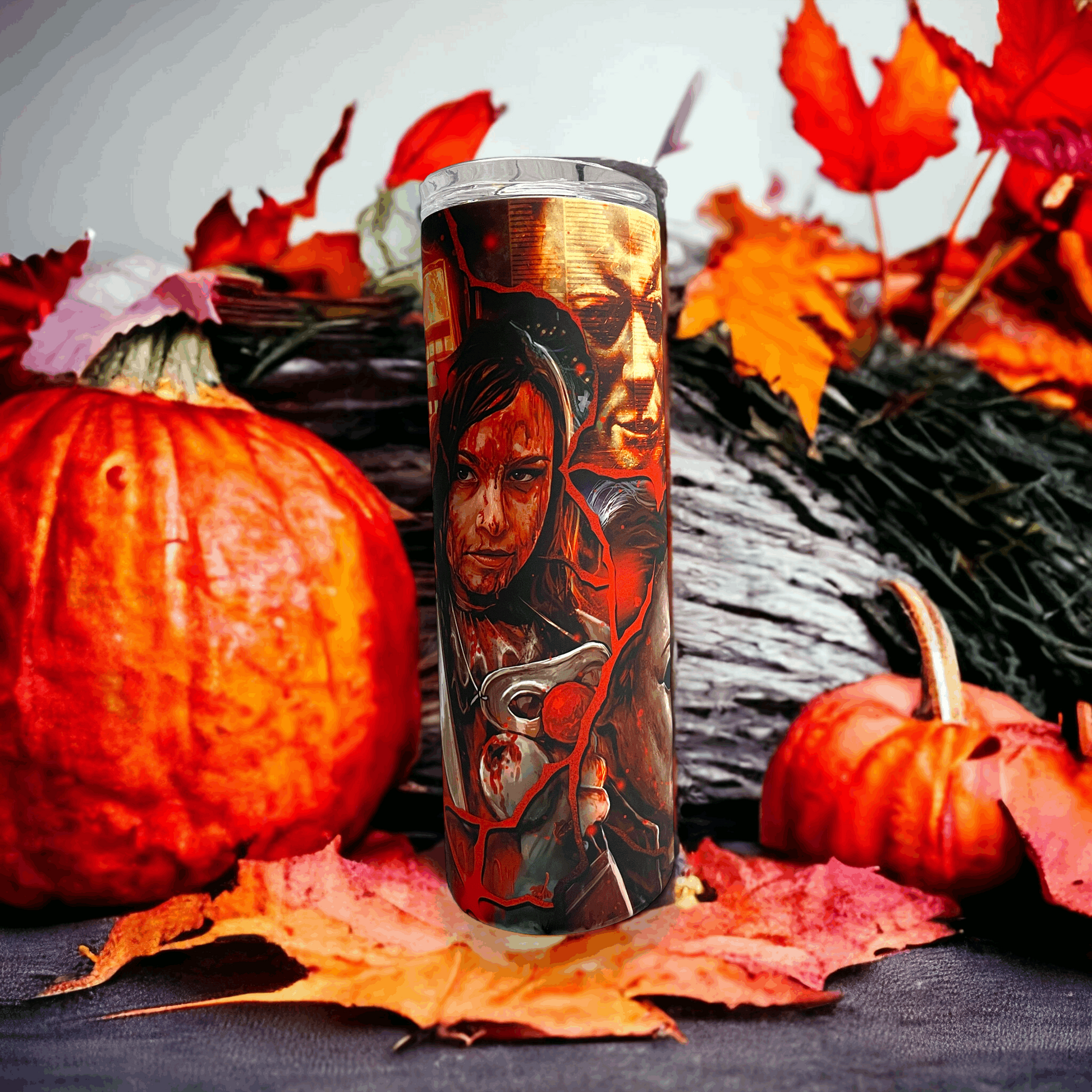 20oz tumbler by Macies Handmade Treasure's featuring michael myers in halloween design with pumpkins and autumn leaves background