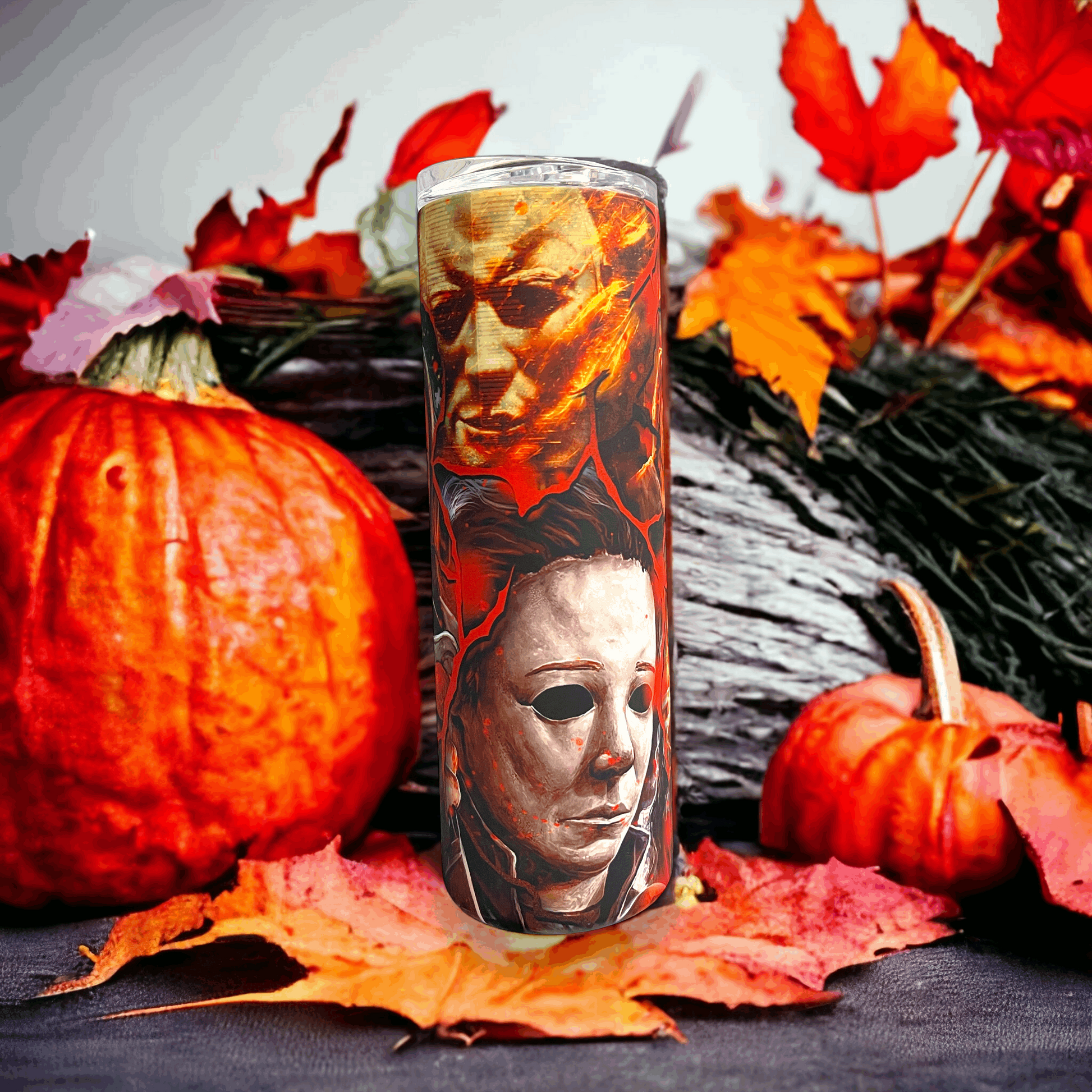 20oz tumbler featuring detailed artwork of michael myers in halloween with pumpkins and autumn leaves