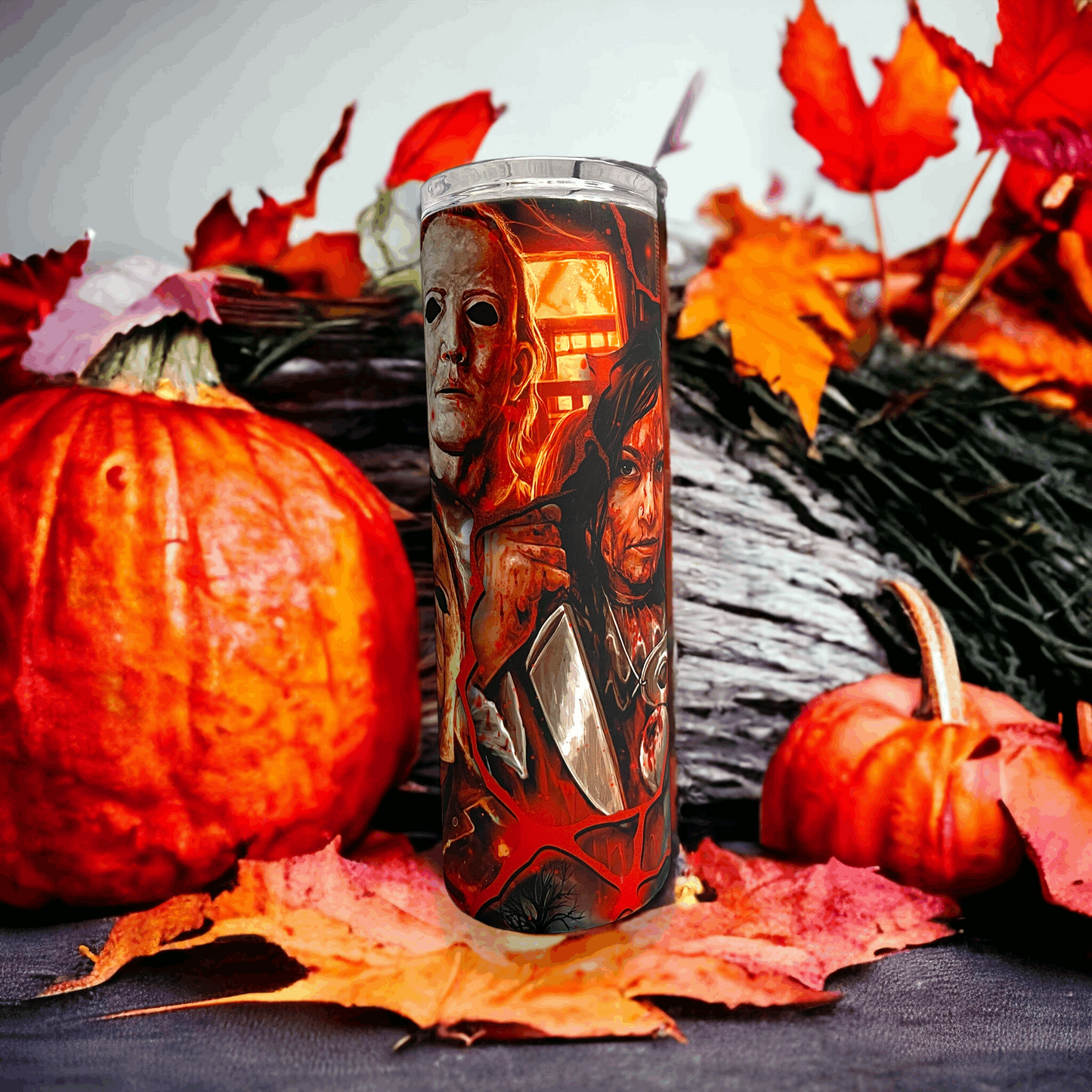 20oz tumbler from Macies Handmade Treasure's featuring michael myers in halloween design with pumpkins and autumn leaves