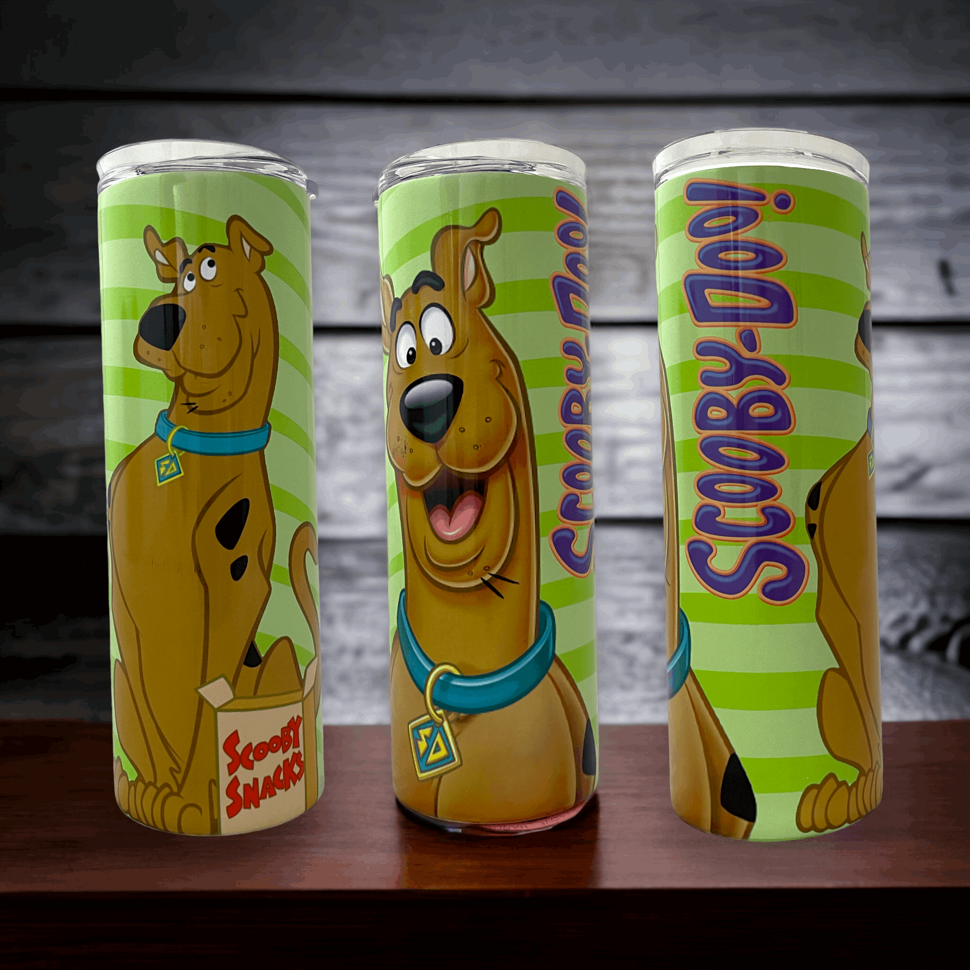 20oz stainless steel tumbler with vibrant green stripes and Scooby Doo cartoon design