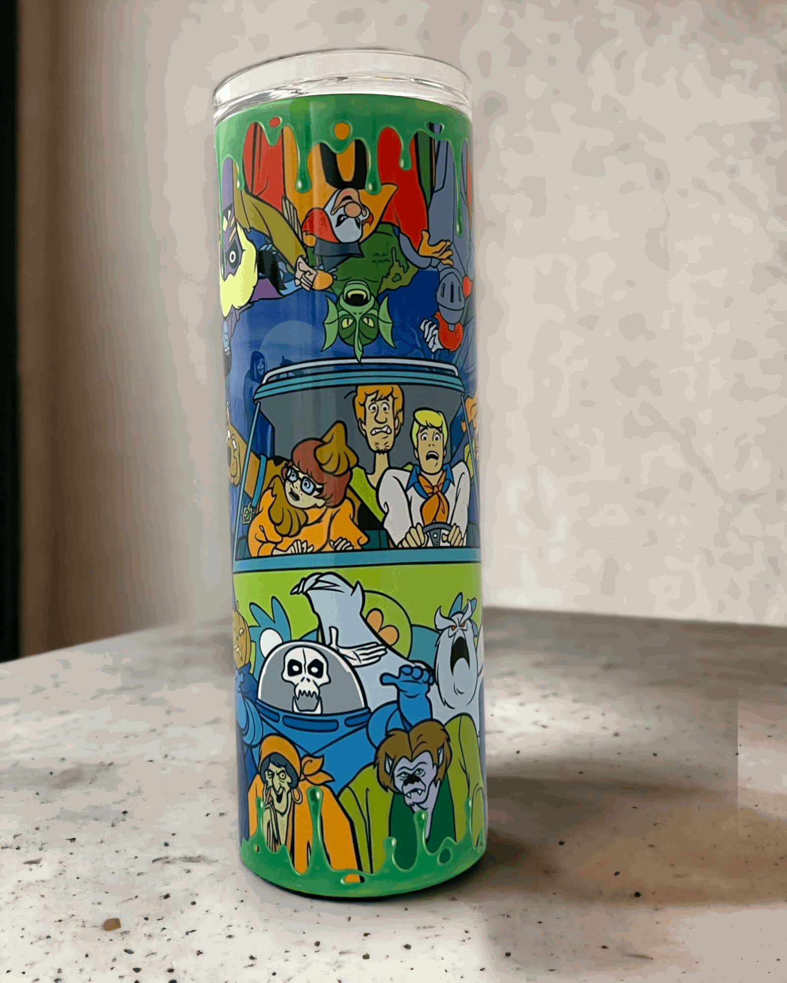 20oz stainless steel tumbler featuring colorful scooby-doo characters and green drip design