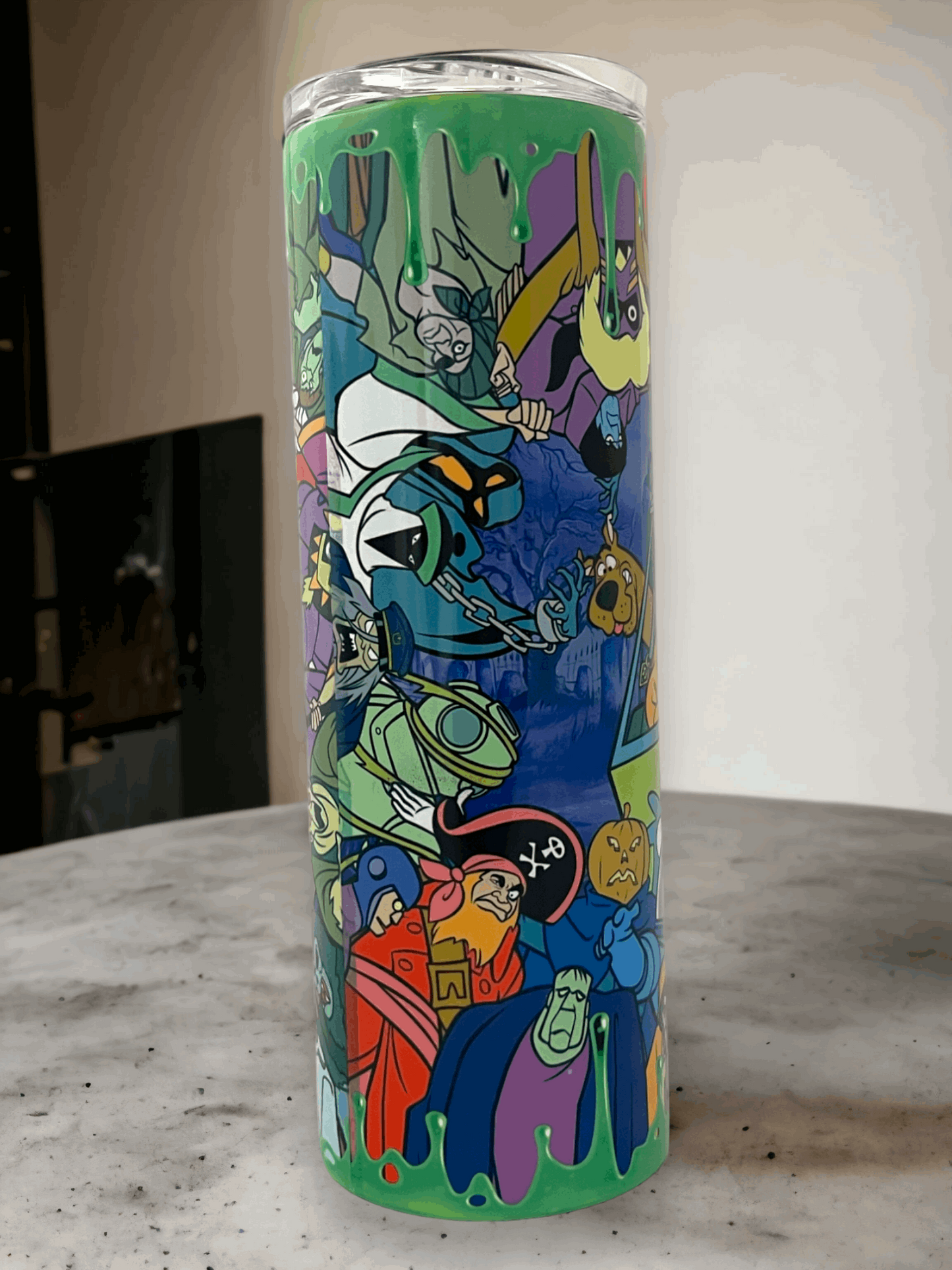 20oz tumbler with colorful scooby-doo characters design on green background from Macies Handmade Treasure's