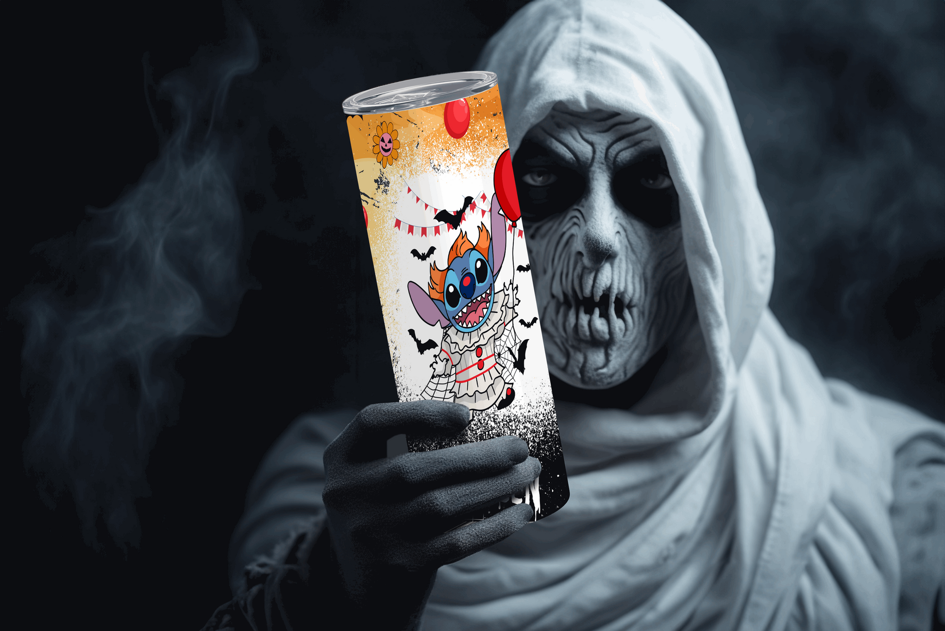 Stanley halloween tumbler 20oz featuring a colorful spooky design held by a person in ghost costume