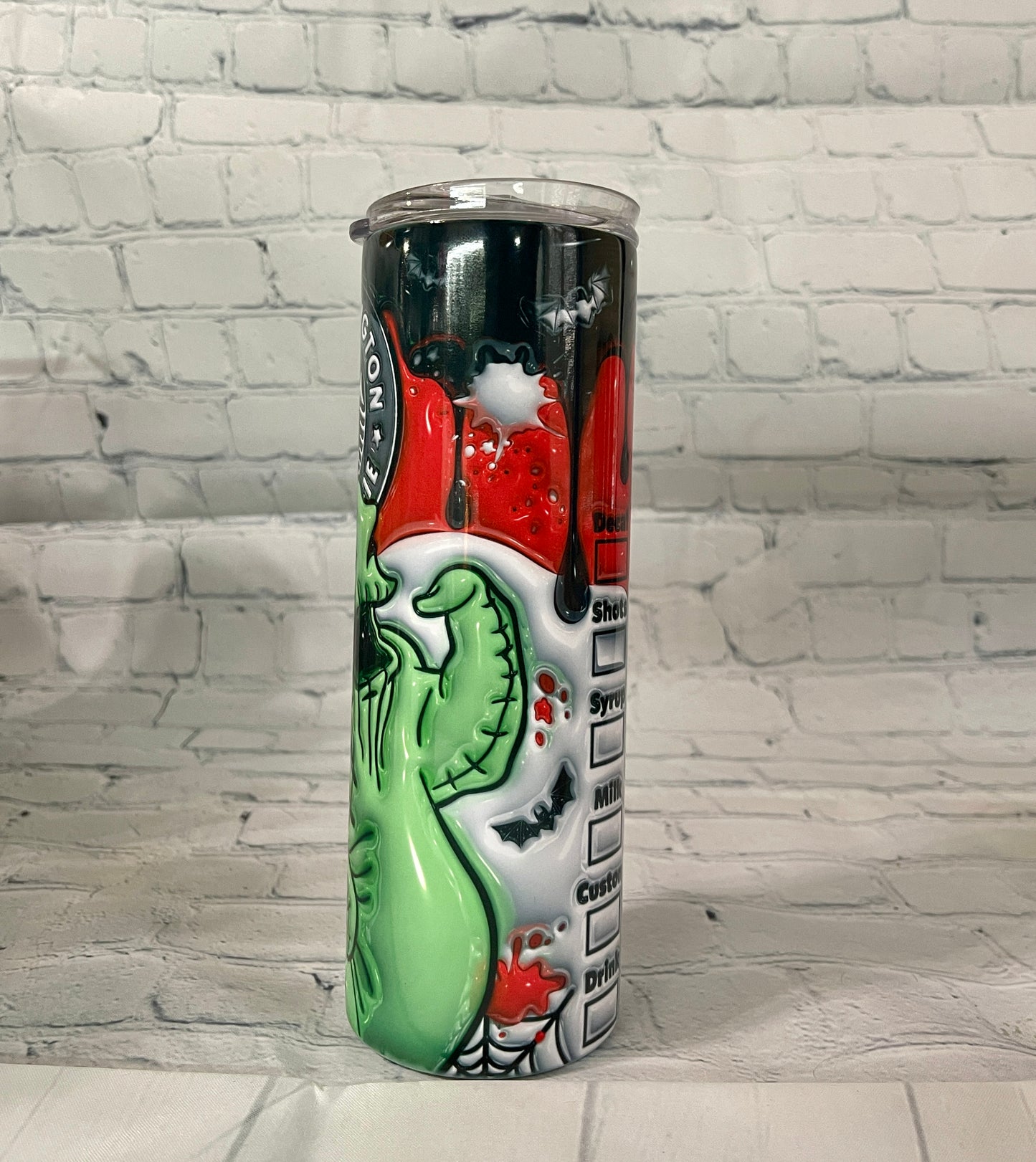 20oz tumbler for coffee with colorful Halloween-themed design including green monster and spiderwebs