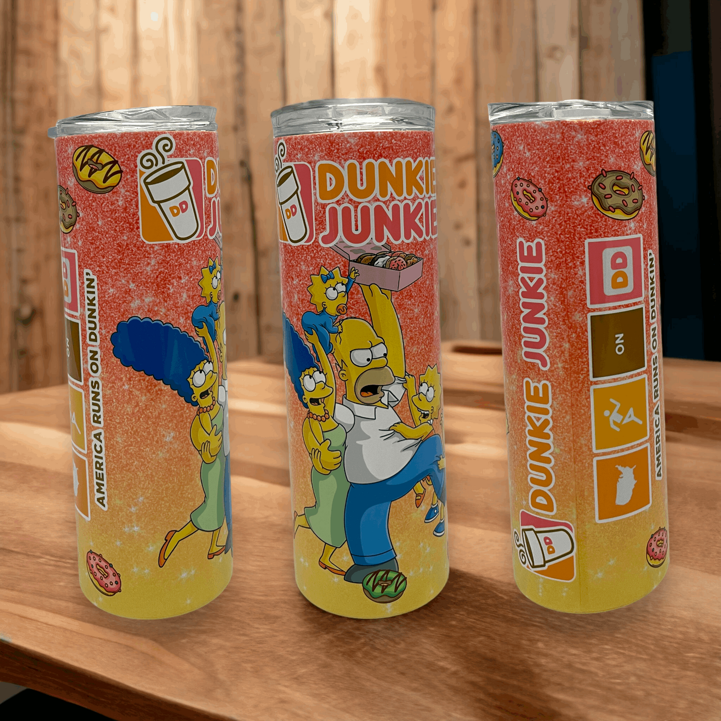 20oz tumbler featuring the simpsons Dunkin Junkie design with colorful donut and coffee graphics