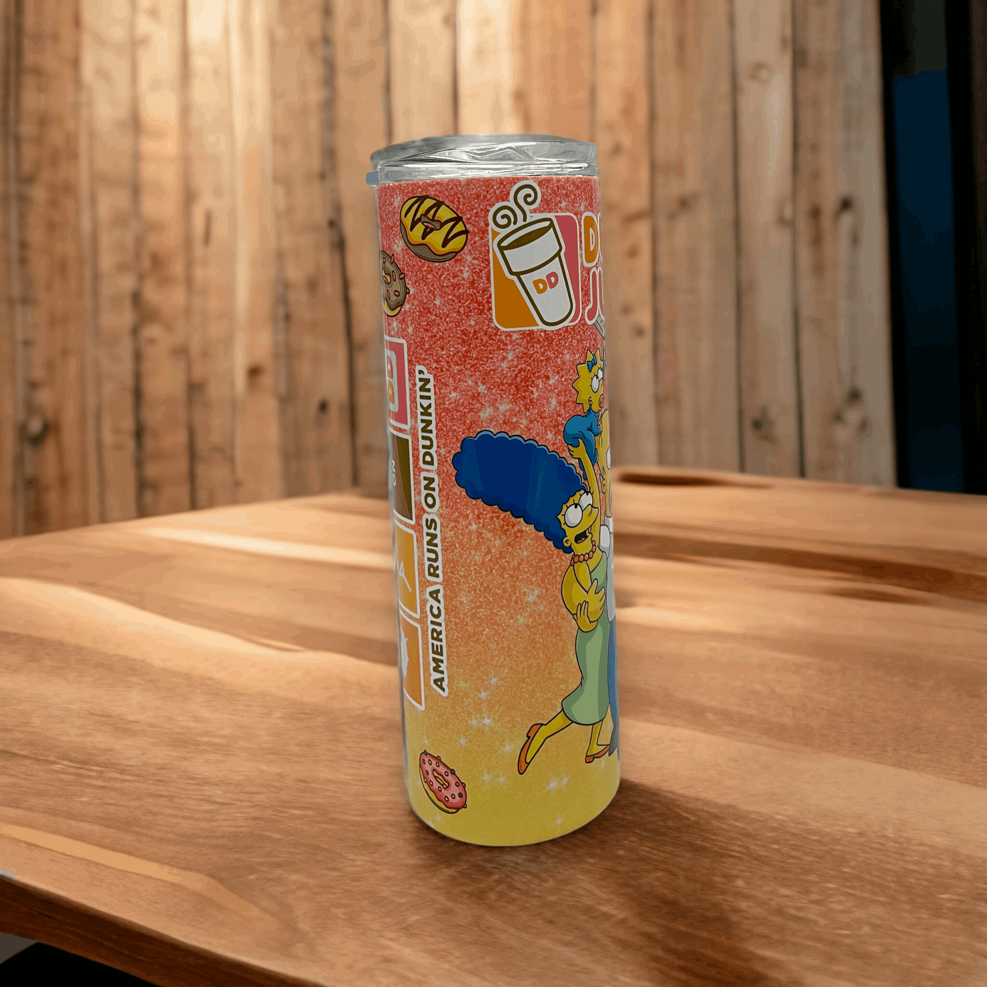 20oz stainless steel tumbler with the simpsons design featuring Marge and colorful stickers on orange background