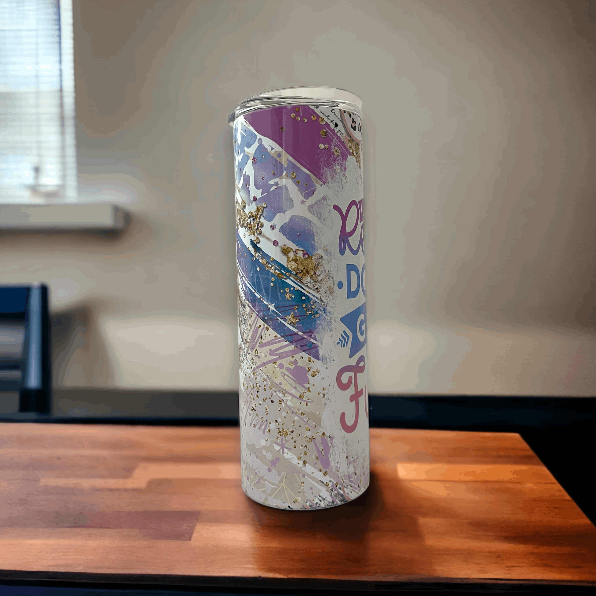 20oz yeti 20oz rambler tumbler with purple, blue, and gold abstract design and inspirational text